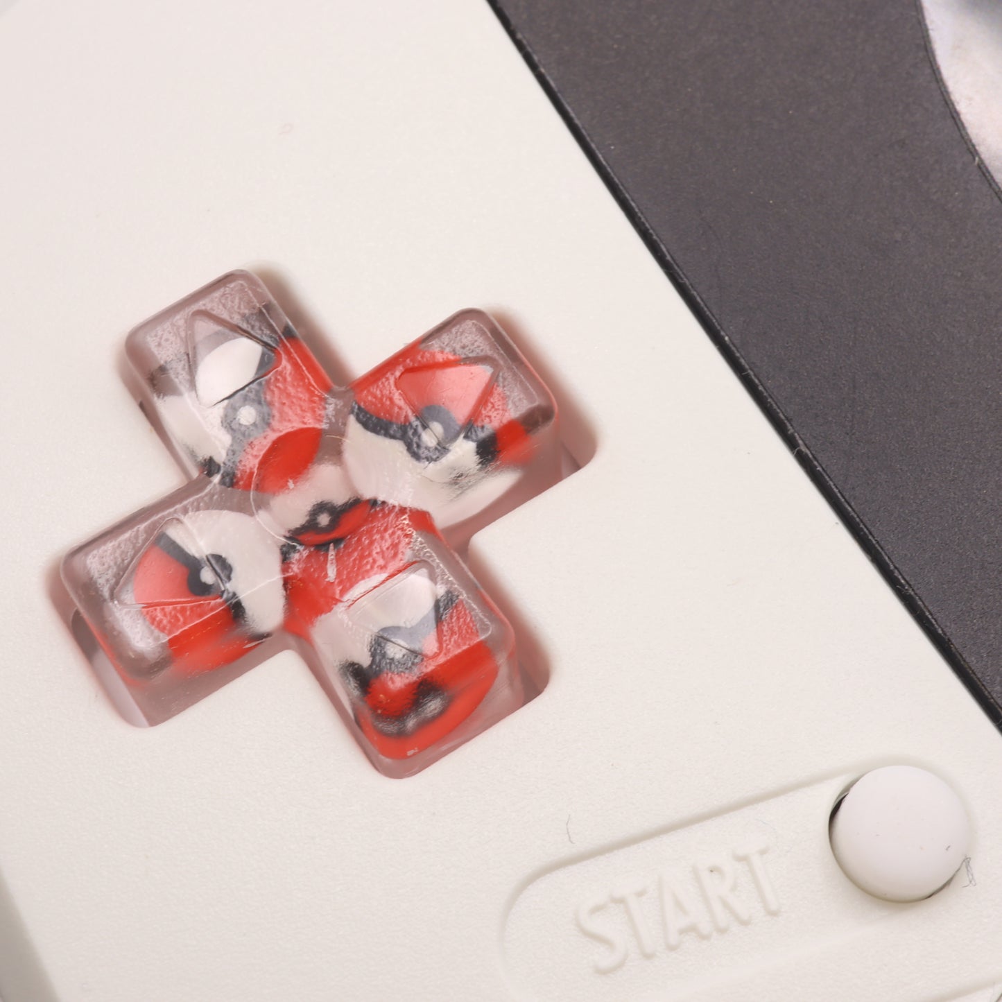 A Game Boy Advance controller with labfifteen Custom Buttons - Pokeball.