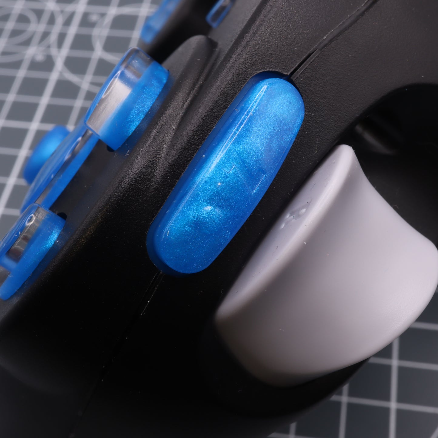 Close-up of a Nintendo GameCube - Custom Button - Blueberry Candy Controller's joystick and custom-cast buttons.