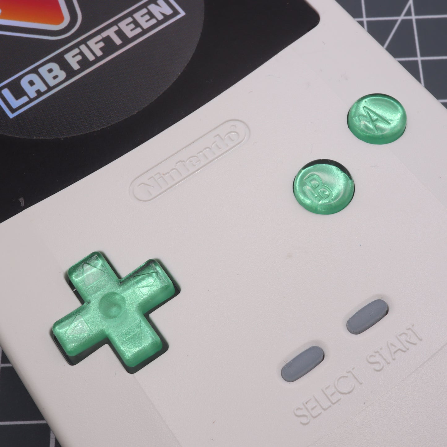 Game Boy Color button set with lab fifteen co chrome mint green custom buttons inside white console