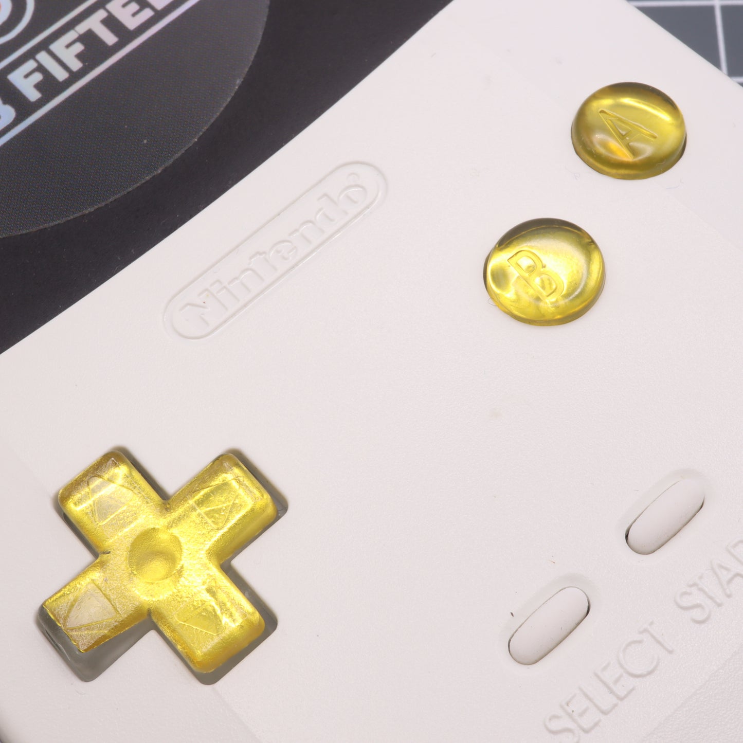 Game Boy Color button set with lab fifteen co silver chrome gold yellow custom buttons inside white shell