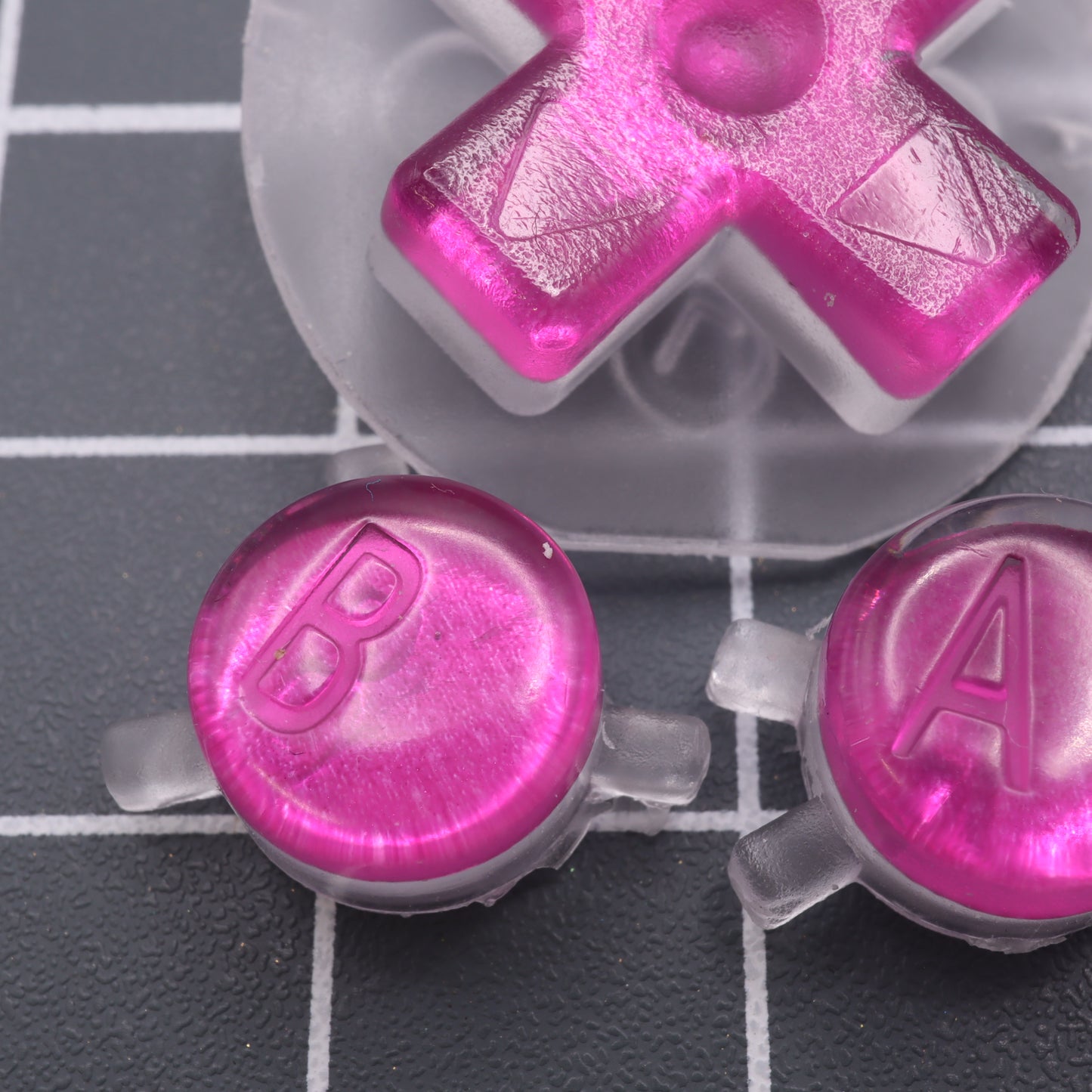 Game Boy Color custom resin buttons by lab fifteen co chrome pink colour close up of internal effect