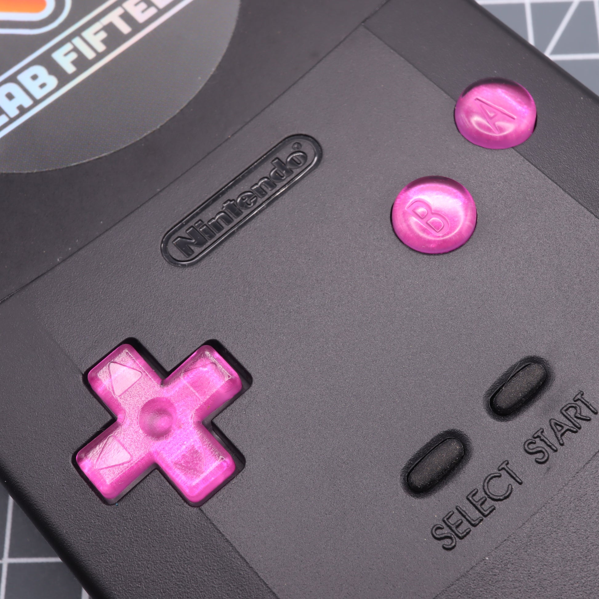Game Boy Color custom resin buttons by lab fifteen co chrome pink colour inside black console shell