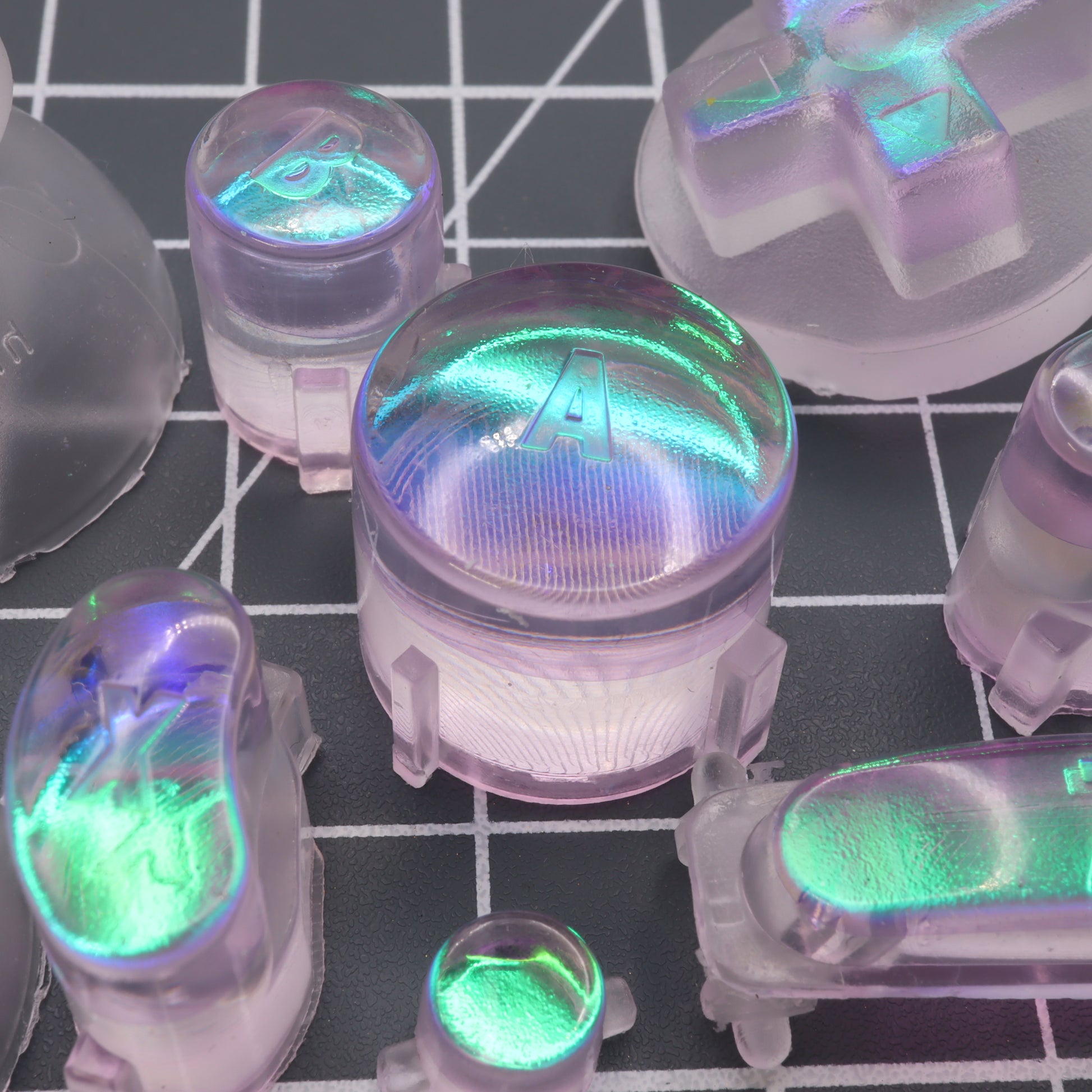 Close-up of backlit mechanical keyboard switches with a GameCube - Custom Button - Cool Opal effect.