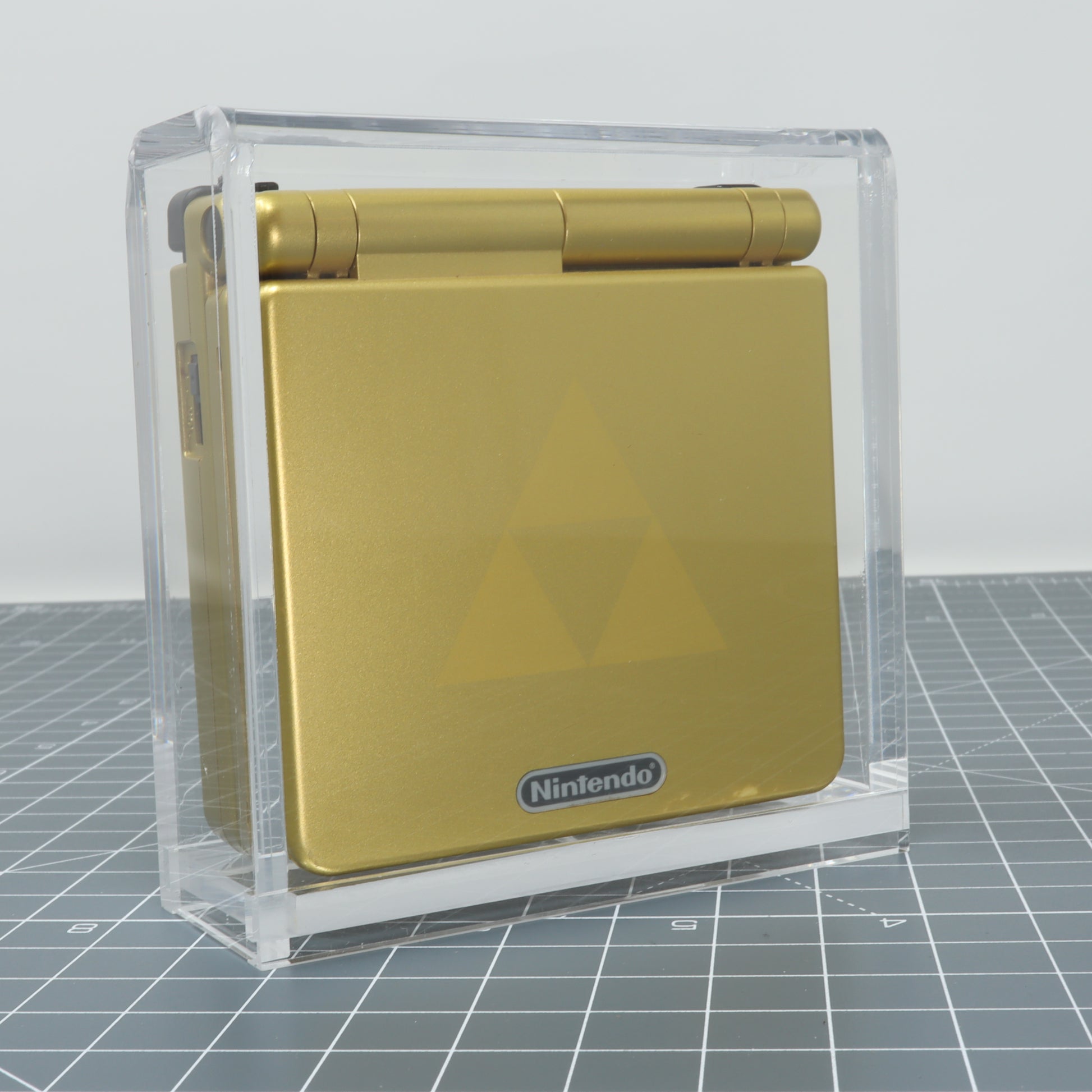 Game boy Advance SP gold zelda edition store inside custom acrylic display capsule front shot