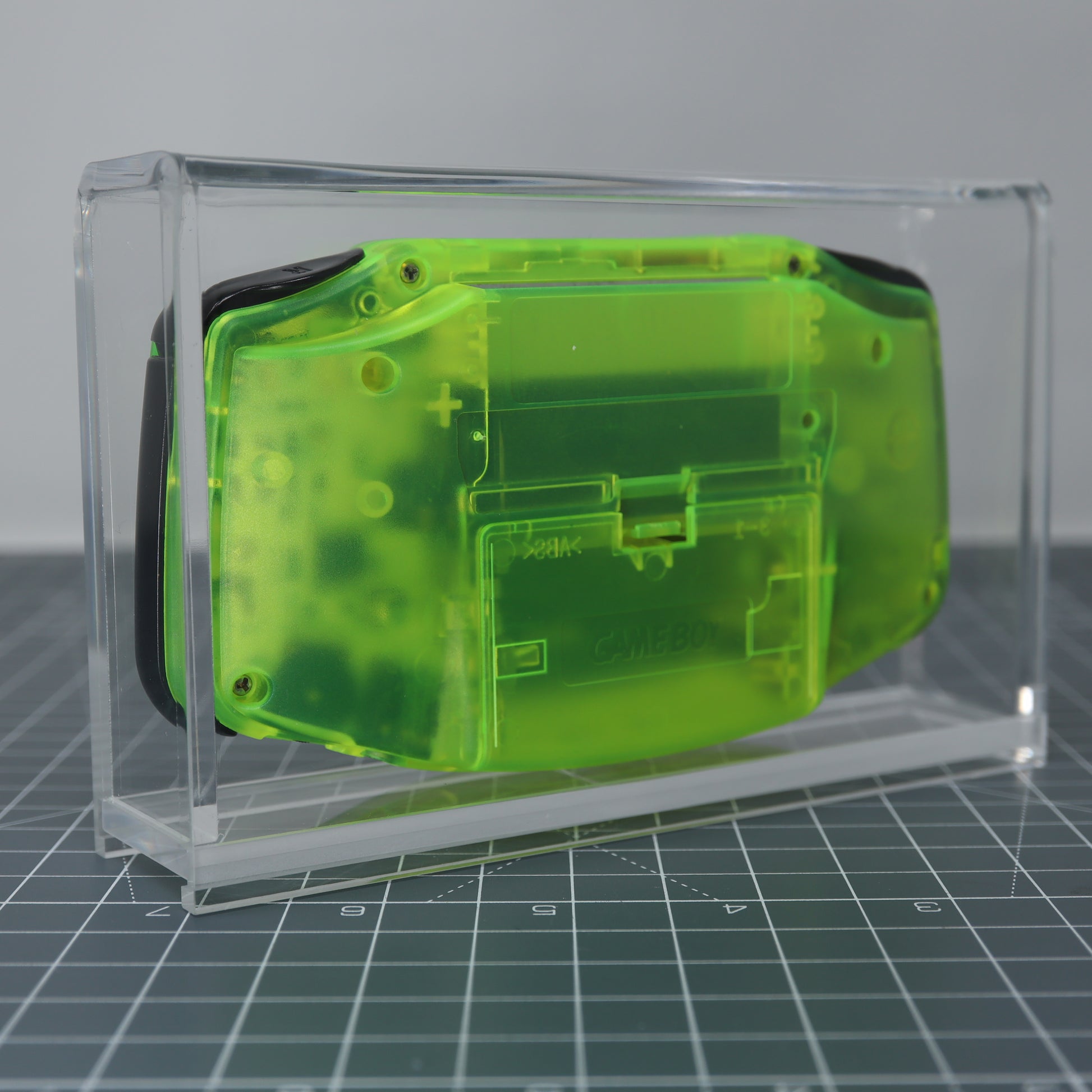 Game boy Advance console safely store inside custom acrylic display capsule rear image