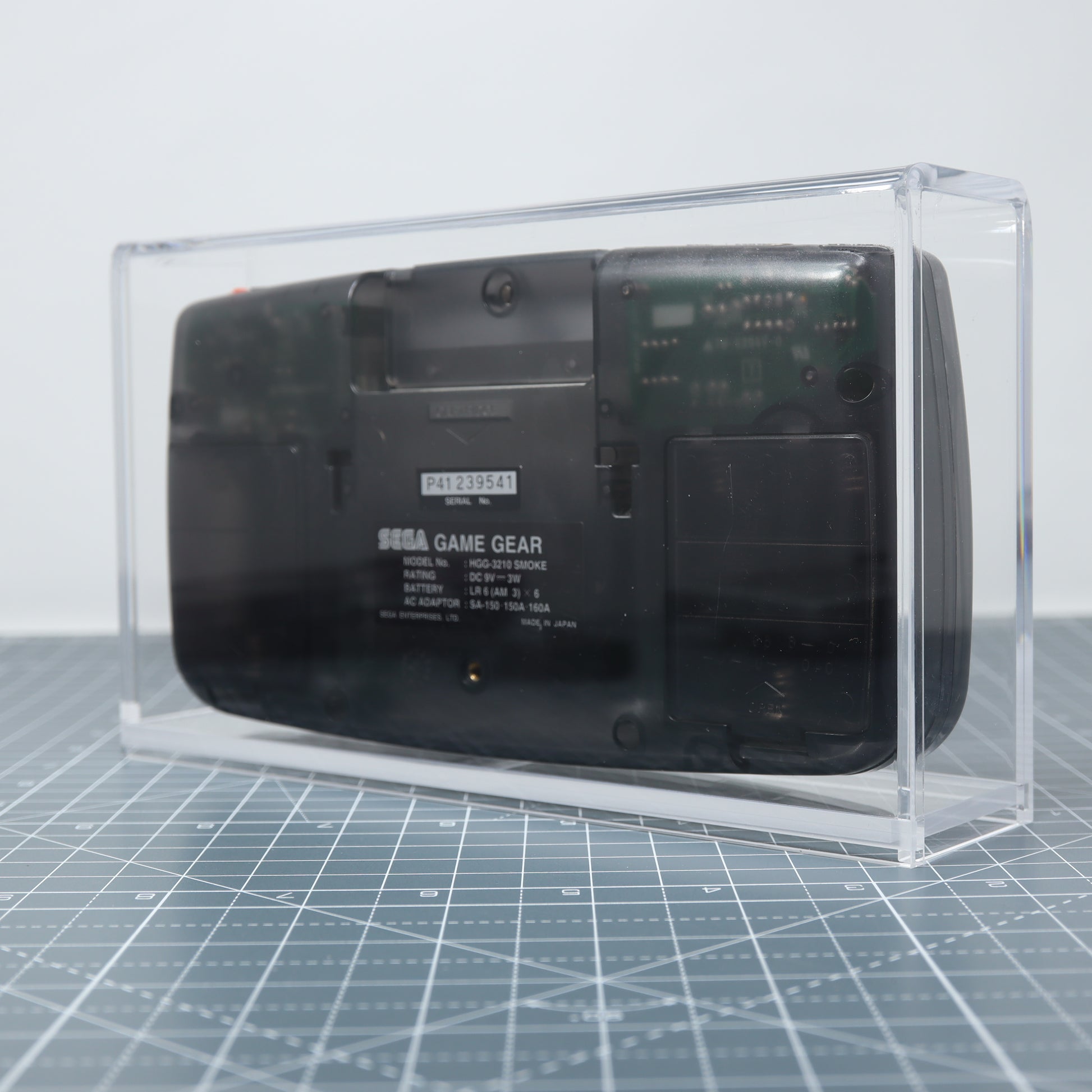 Sega Game Gear Smoke Black edition console on display in custom acrylic display capsule rear
