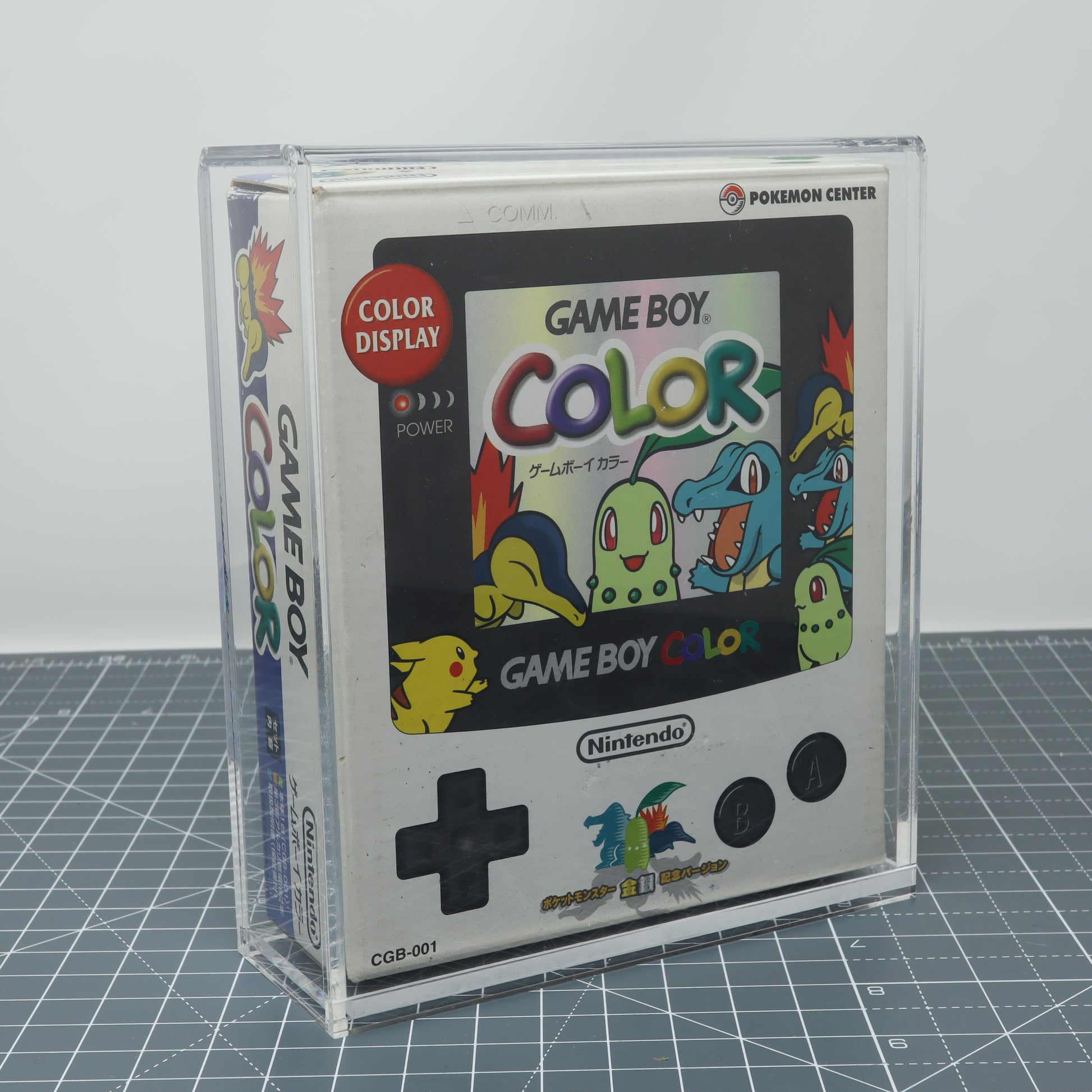 Game Boy Color Pokemon center limited addition boxed console stored inside custom acrylic display capsule front image