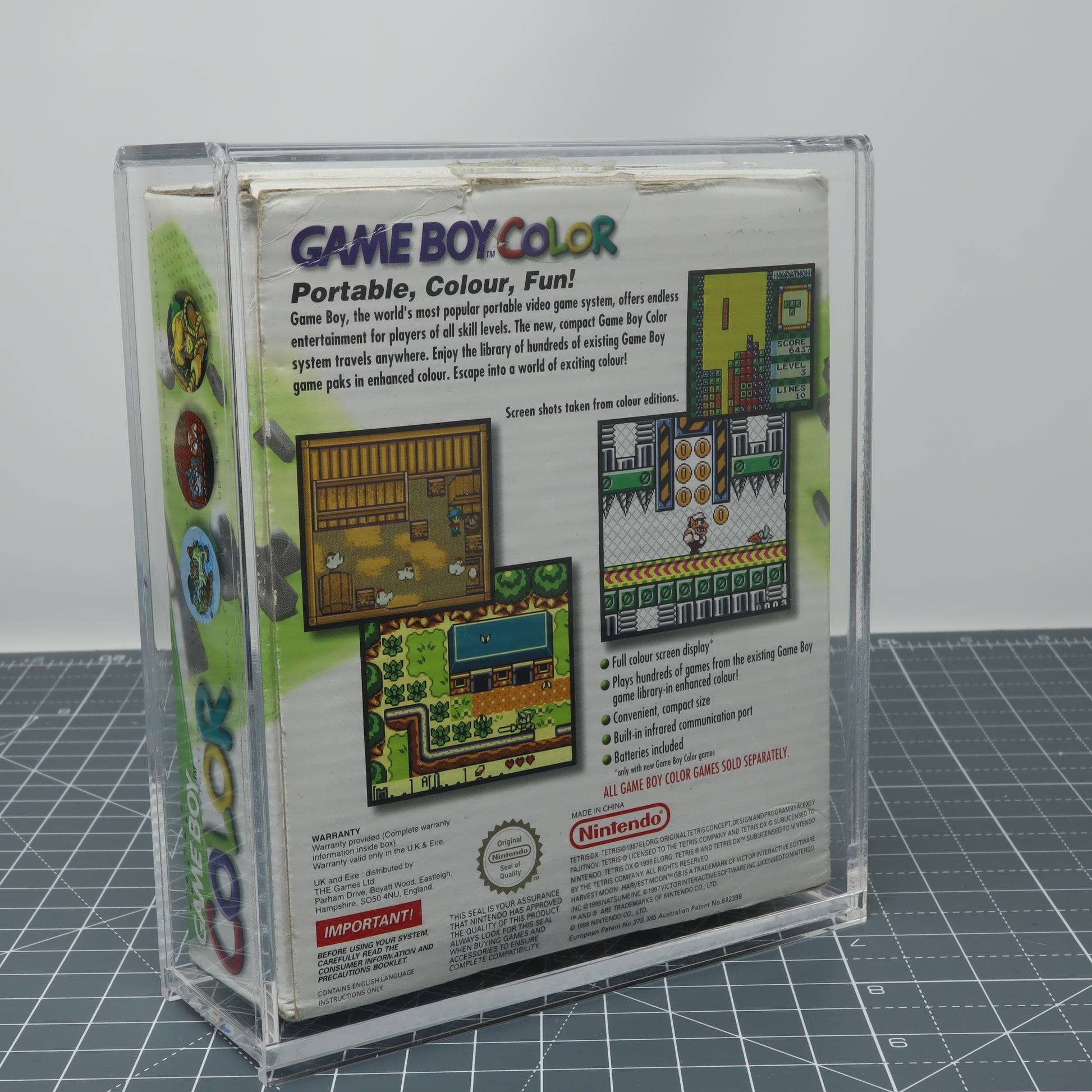 Game Boy Color Kiwi Green boxed console stored inside custom acrylic display capsule rear image
